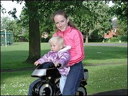  two children on play equipment 