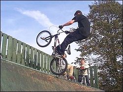  half-pipe ramp with bike rider